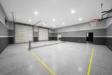 Indoor basketball and mini pickleball court in private entertainment complex