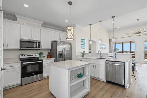 Your spacious kitchen features modern appliances, granite counters, and an island perfect for cooking memorable meals together.