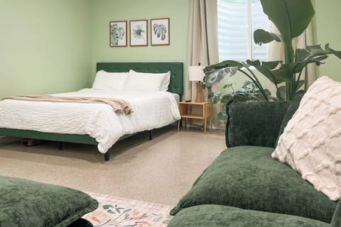 Queen and Twin Beds with a Studio setup, sharing space with the living room area