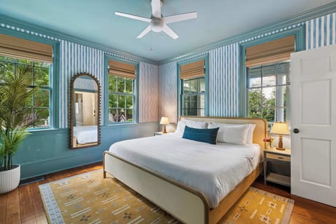 Bedroom #1: Comfortable king bed, TV, and abundant natural light, creating a warm and inviting retreat after a day of exploring.