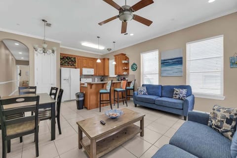 Living Room: Open-concept layout connects the living room, dining area, and kitchen for a welcoming, social feel.