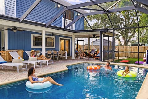 Dive into your private coastal oasis... pool, floaties, and plush loungers
