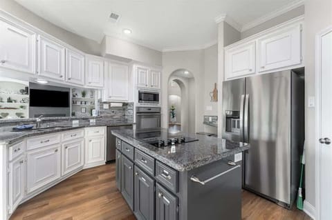 Planing to cook? High ceilings, lake views, and a well stocked kitchen makes this the perfect place to share meals with friends or family.