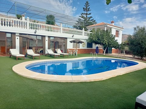 the pool area of Finca la Casilla, with the downstairs kitchen in the background