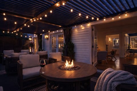 Elegant outdoor lounge designed for relaxed evenings by the fire