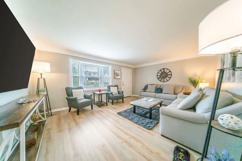 Designed for togetherness, the spacious living room flows seamlessly into the rest of the home, offering an inviting spot to gather for conversation or catch the big game.