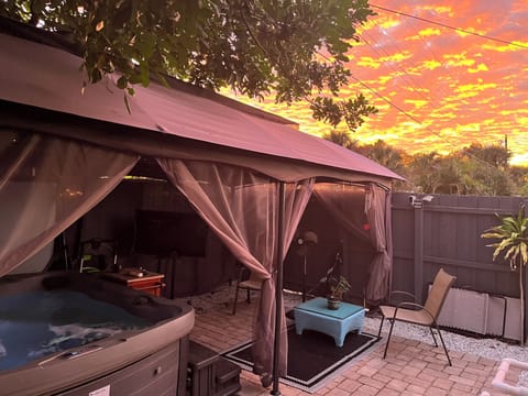 Hot tub under gazebo and beautiful sunsets