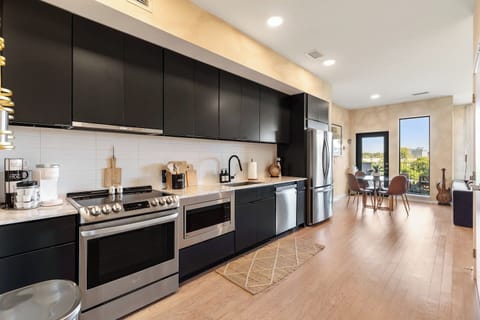 Fully equipped kitchen with high-end appliances.