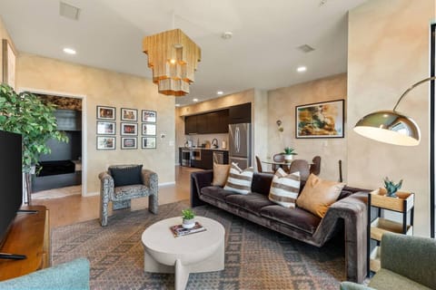 Spacious living room with a stylish couch, stunning riverfront views, and a Smart TV for your entertainment. Enjoy your morning coffee on our private patio that overlooks Cumberland river.