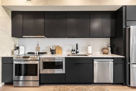 Fully equipped kitchen with high-end appliances.