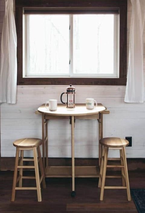 dining table opens to pull out two more stools