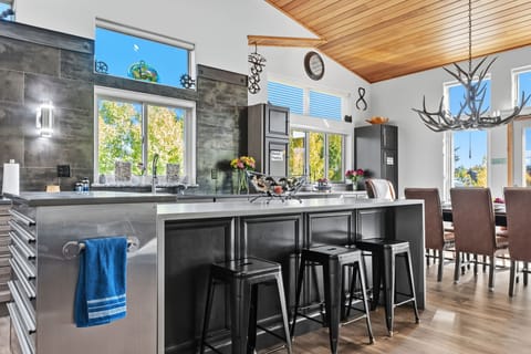 Kitchen: Main floor, drip coffee maker, Keurig, toaster, air fryer, cooking utensils, tableware