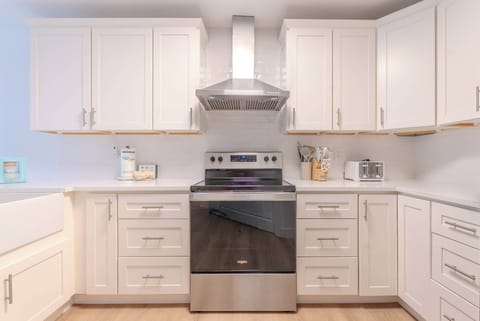 Modern kitchen with sleek, updated appliances and plenty of workspace.