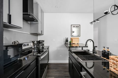 Sleek designs and high-end appliances make cooking a delight in this stylish space!