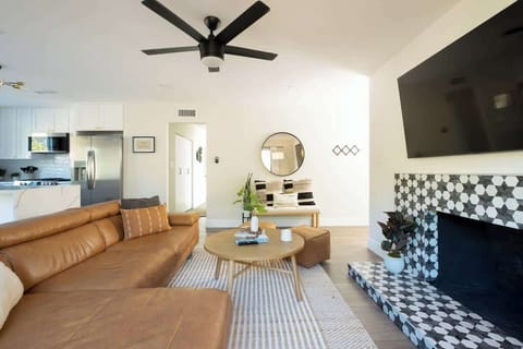 The large wall mounted Smart TV comes with Netflix and Hulu included