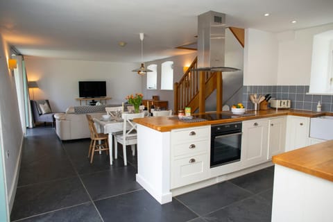 Open plan living area with tiled floor
