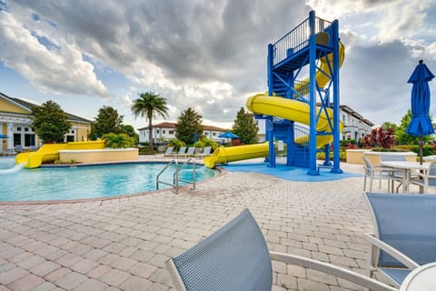 Resort-style pool with thrilling water slides and plenty of lounge seating.