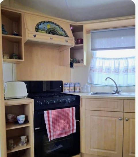 Cozy kitchen with ample storage and natural light