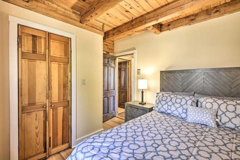 Cozy bedroom retreat with rustic wood beam ceiling