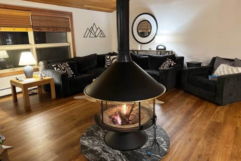 After a day full of adventure, relax in the living-room by the wood fireplace!