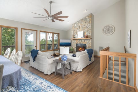 Open and inviting with a cozy fireplace.