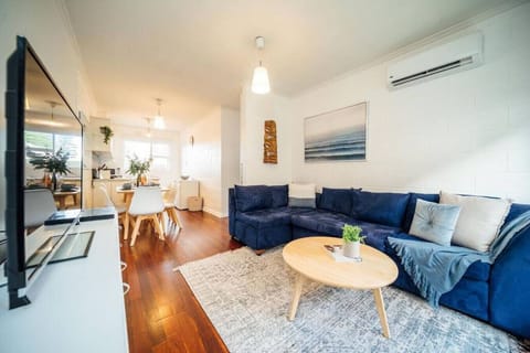 Relax on the spacious L-shaped sofa with Netflix, Apple TV, DVD player and air conditioning, creating an inviting spot for cosy evenings.