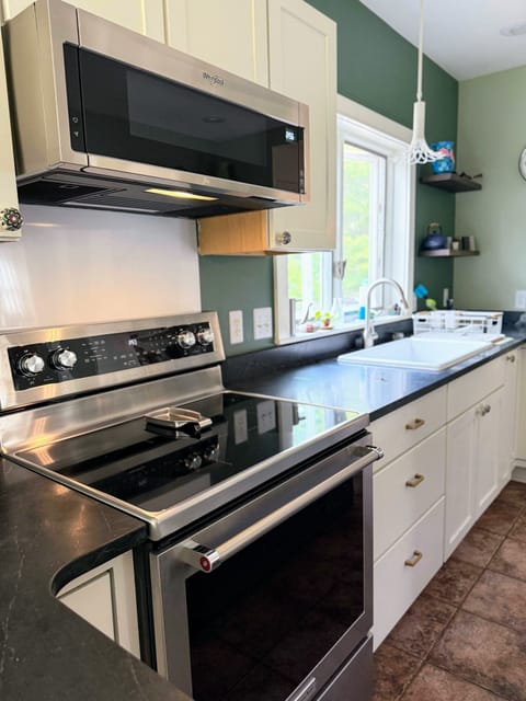 New stove and microwave in large kitchen
