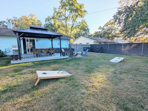 Enjoy friendly competition with tetherball and cornhole on the lush backyard lawn, fun for kids and adults alike!