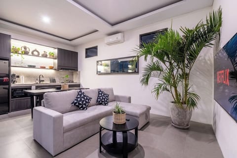 Unwind in the peaceful charm of The R Villa Dempo. The stylish, cozy living room is perfect for hanging out with friends or enjoying a Netflix night in. #The R Villa Dempo