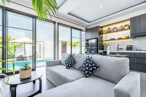 The living room at The R Villa Dempo- blends style and comfort, making it perfect for fun times with friends. #The R Villa Dempo