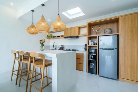 A bright, modern kitchen with top-tier appliances, clean lines, and an open layout designed for effortless cooking and entertaining. #Villa Tambora