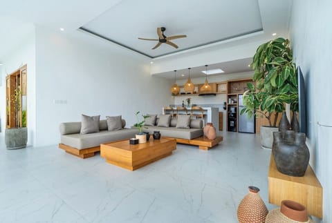 Unwind in the peaceful charm of Villa Tambora. The stylish, cozy living room is perfect for hanging out with friends or enjoying a Netflix night in. #Villa Tambora