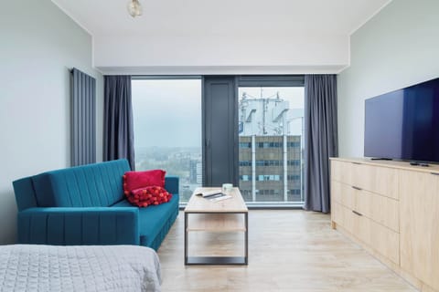 A tastefully designed open-plan studio filled with natural light and modern furnishings.