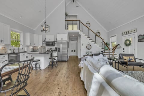 Large windows fill the home with light, creating a warm and inviting atmosphere.