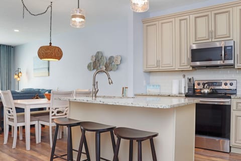 Kitchen with Bar Seating and Dining Area
