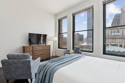 Wake up to sweeping city views from a bright corner room.