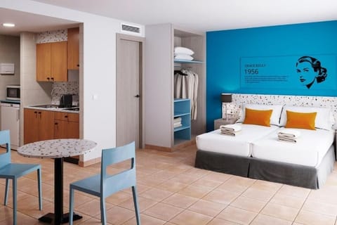 Settle into a spacious studio with kitchenette and crisp linens.