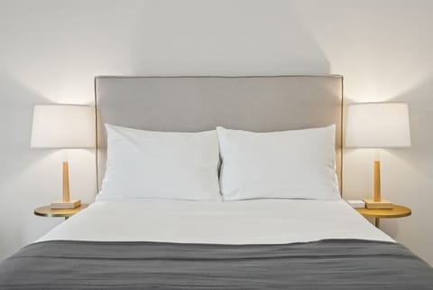 Sink into crisp linens for a restful night’s sleep.