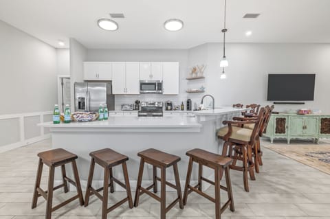 Spacious kitchen with island seating and modern appliances.