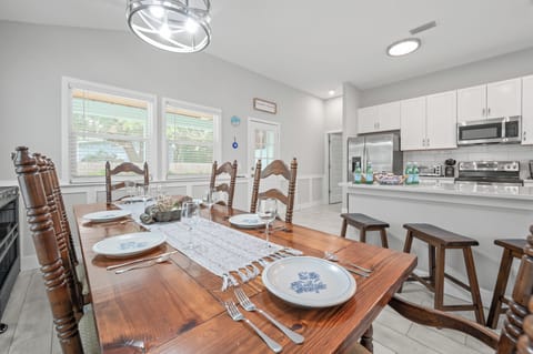 Dining area with seating for six beside the kitchen.
