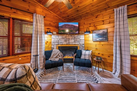 Heart of the cabin where you can enjoy movie nights and chat with loved ones