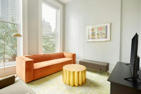 Spacious living room with comfortable seating and a TV.