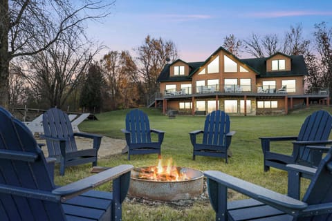 Our home sits on 6 acres of wooded, private and beachfront land that is perfect for large groups to be entertained. We have a spacious fir pit area by the water, beach toys and chairs, dock with boat tie ups, a hot tub, kayaks, and paddle boards.