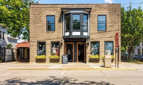 Charming brick facade with bay window and inviting street-front appeal