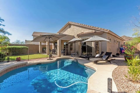 Private backyard pool with BBQ for outdoor enjoyment.