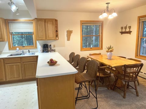 Hangout in the open concept kitchen, dining and living room.