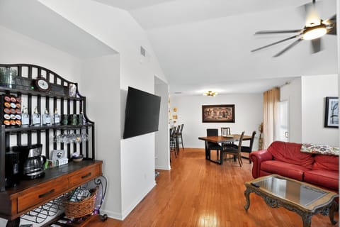 Relax in a sun-filled space with comfortable seating and smart TV