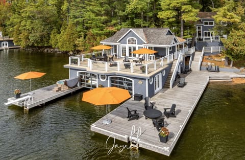 Lakeside dock with cozy seating and vibrant umbrellas