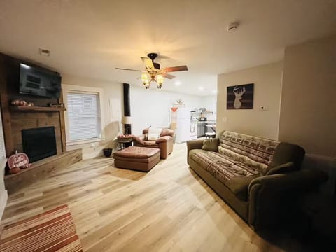 Inviting living room with warm lighting and comfy seating.