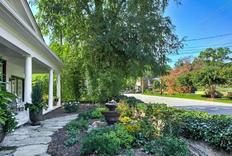 Charming front garden filled with seasonal blooms and welcoming touches.